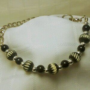 Handmade jewelry set with bracelet and earrings with engraved elk bone beads